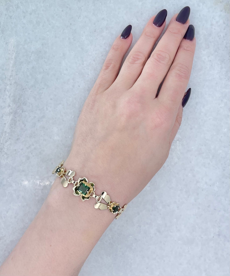 14kt Gold Bracelet Adorned with Green Clover Leaf Accents