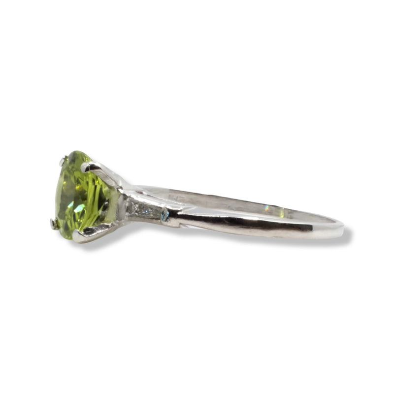 Eye Catching Peridot & Baguette Diamond Three Stone Ring in Platinum